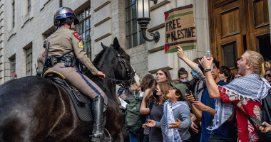 Officer on horseback confronts protestors