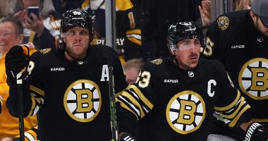 Brad Marchand and David Pastrnak of the Boston Bruins going against the Toronto Maple Leafs