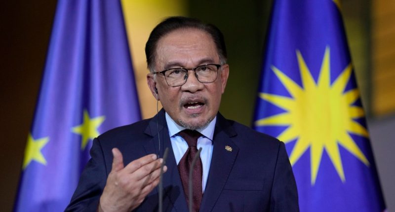 Malaysia’s Anwar unveils record public pay hike amid ringgit’s slide | Business and Economy