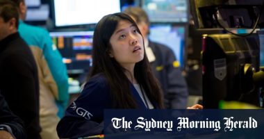 Banks, utilities boost ASX as rates hold steady; Fortescue dives